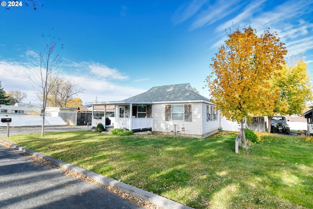 view of front of house featuring a front lawn and a porch