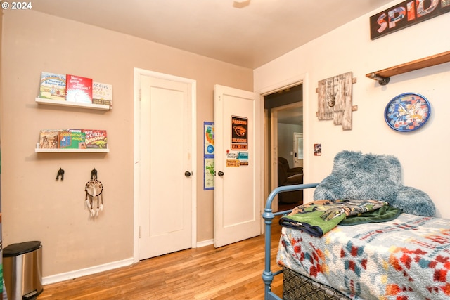 bedroom with hardwood / wood-style floors