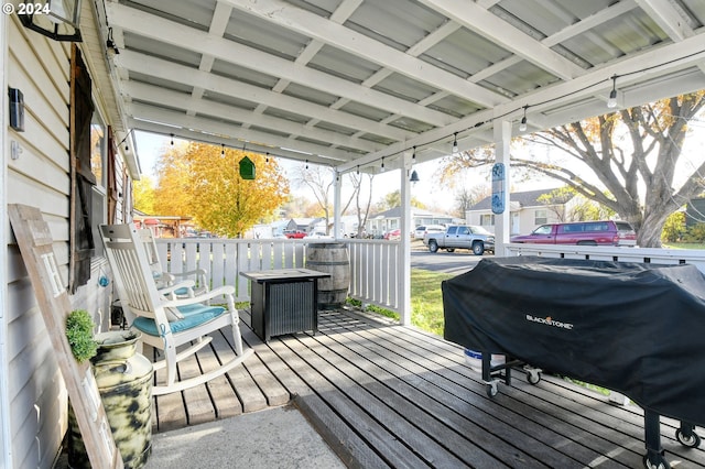 wooden terrace featuring grilling area