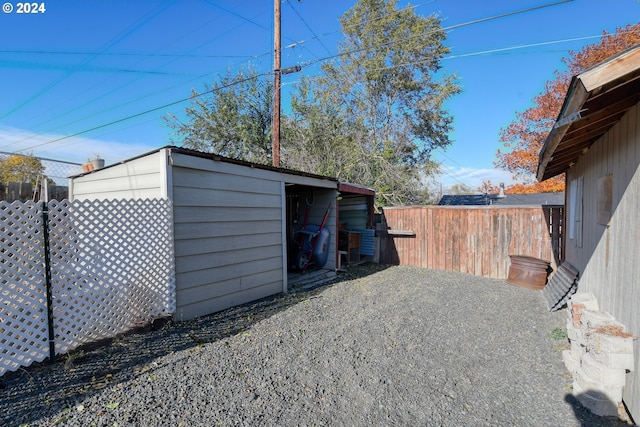 exterior space featuring a shed