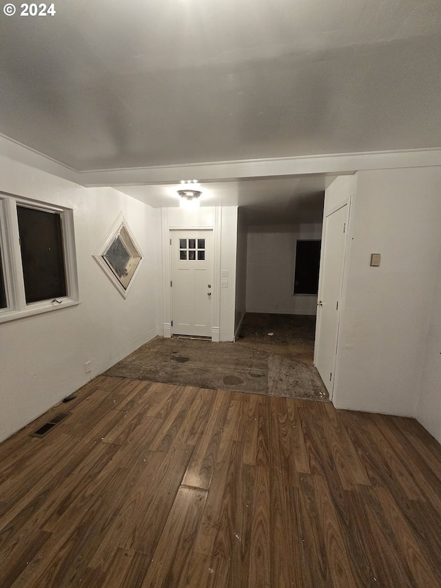 entrance foyer with dark hardwood / wood-style floors