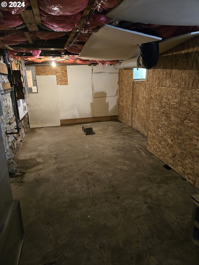 basement featuring electric panel