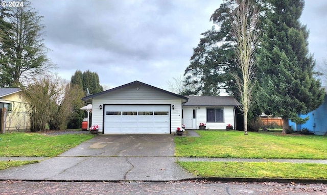 single story home with a garage and a front yard