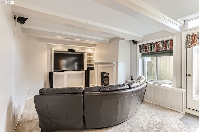 10420 SW 153rd Ave, Beaverton, OR 97007 - carpeted living room featuring beamed ceiling and a tiled fireplace