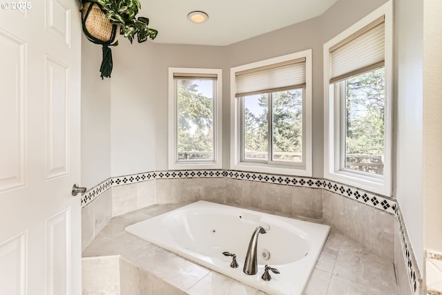 bathroom featuring a relaxing tiled tub