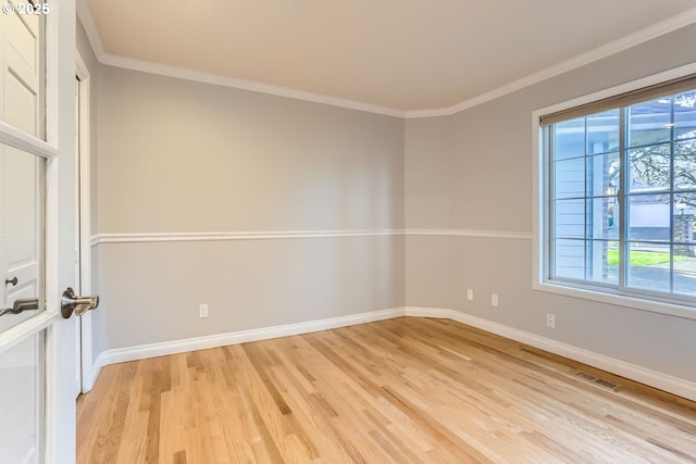 10420 SW 153rd Ave, Beaverton, OR 97007 - empty room with light wood-type flooring, healthy amount of natural light, ornamental molding, and baseboards
