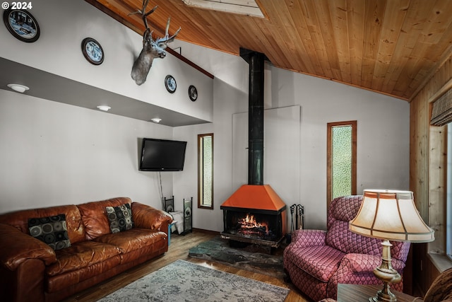 living room featuring high vaulted ceiling, a wood stove, wooden ceiling, and hardwood / wood-style floors