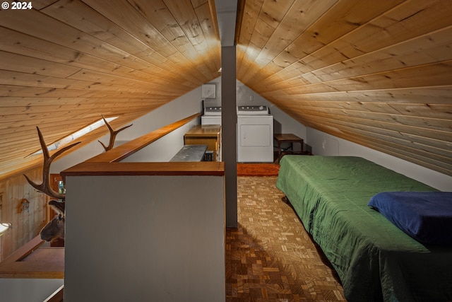 unfurnished bedroom featuring wood walls, separate washer and dryer, parquet flooring, wooden ceiling, and vaulted ceiling