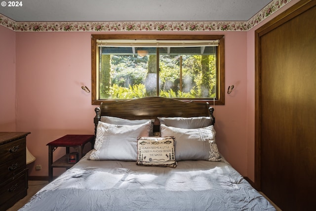 bedroom featuring multiple windows