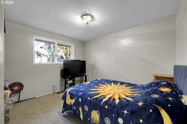 bedroom featuring carpet and a textured ceiling