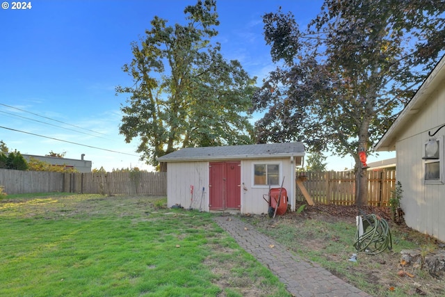 view of outbuilding featuring a yard