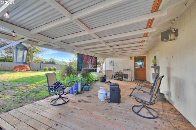 wooden terrace featuring a yard