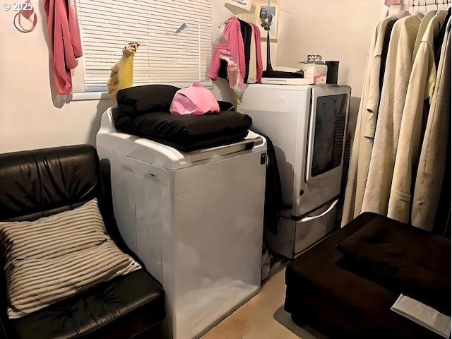 laundry room with separate washer and dryer and laundry area