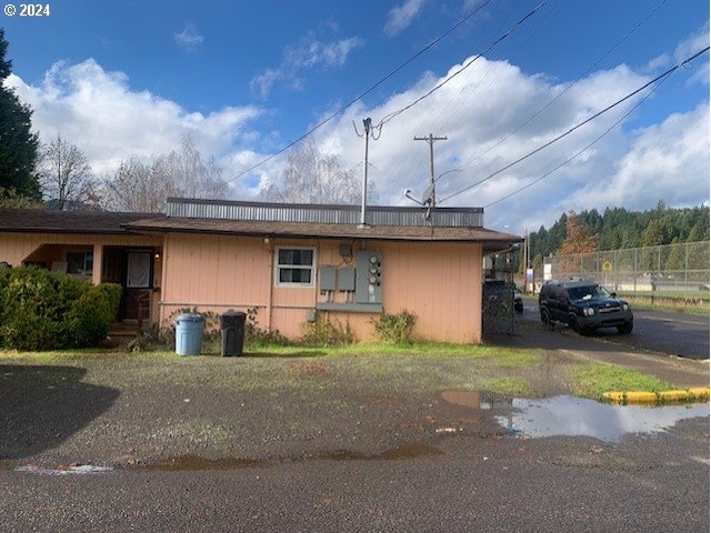 view of home's exterior with fence