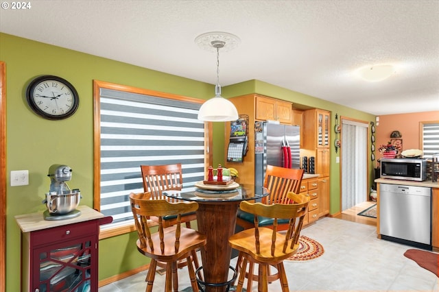 3824 Brighton Ave, Eugene, OR 97405 - dining space with a textured ceiling