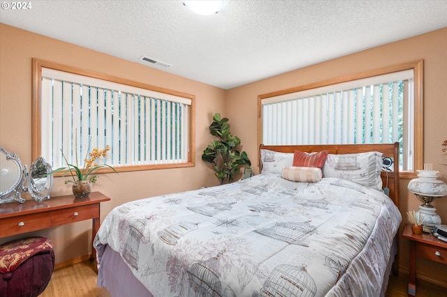 3824 Brighton Ave, Eugene, OR 97405 - bedroom featuring wood finished floors and a textured ceiling