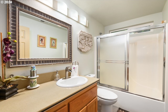 3824 Brighton Ave, Eugene, OR 97405 - bathroom featuring toilet, vanity, and enclosed tub / shower combo
