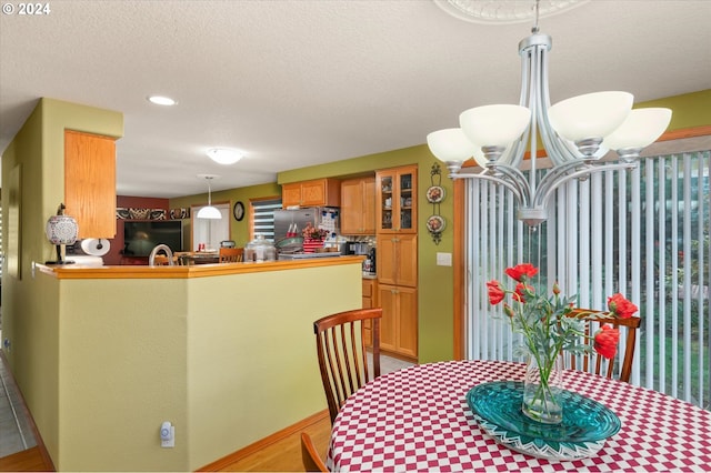 3824 Brighton Ave, Eugene, OR 97405 - dining space featuring a chandelier, recessed lighting, and a textured ceiling