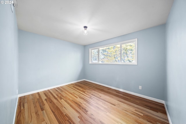 empty room featuring hardwood / wood-style flooring