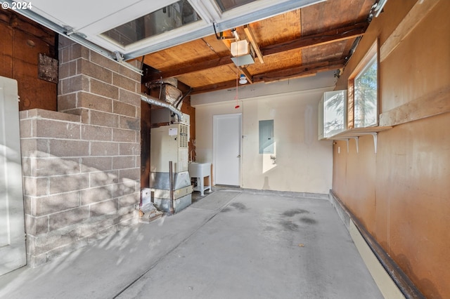 garage with electric panel and sink