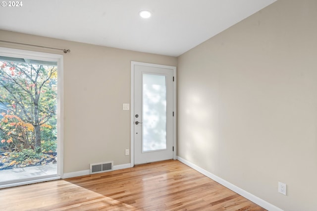 doorway to outside with light hardwood / wood-style floors