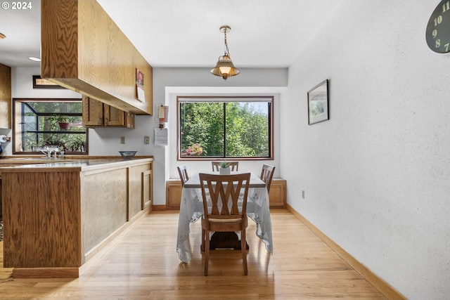 dining area featuring light wood-type flooring