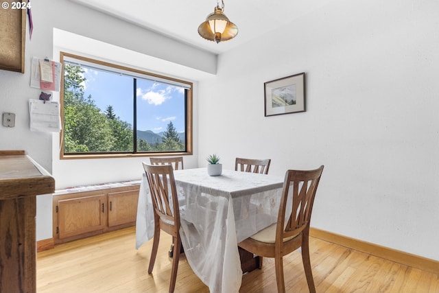 dining area featuring light wood-type flooring