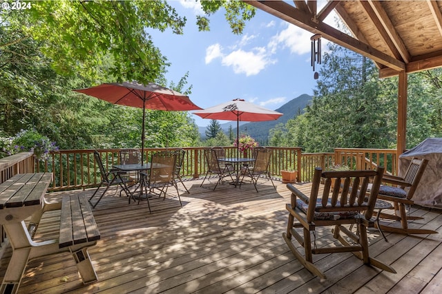 wooden deck featuring a mountain view