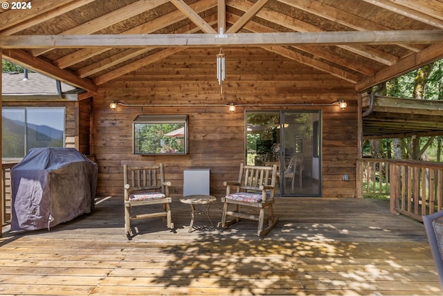 wooden deck with a grill