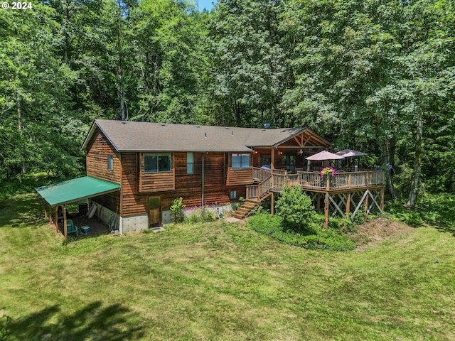 back of house with a lawn and a deck