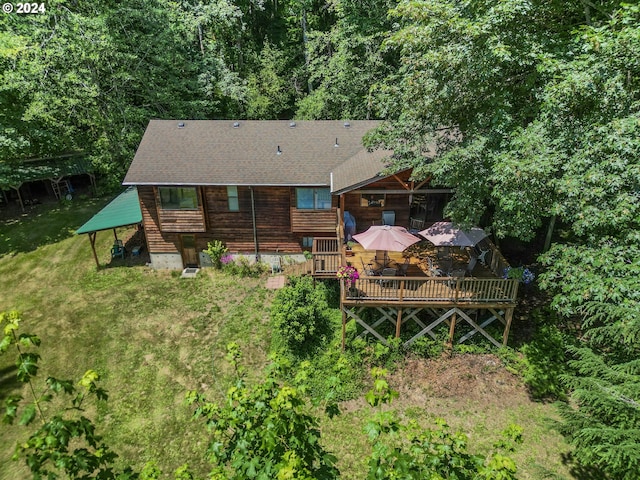 back of house with a wooden deck