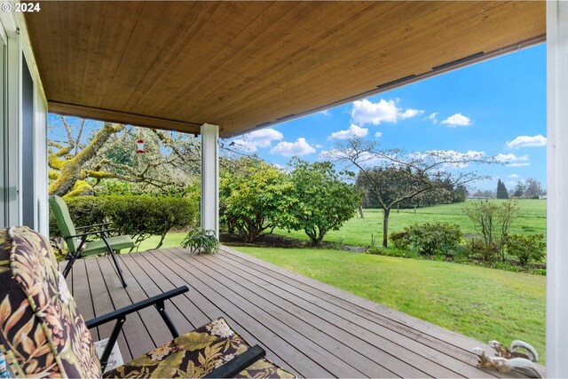 wooden deck with a yard