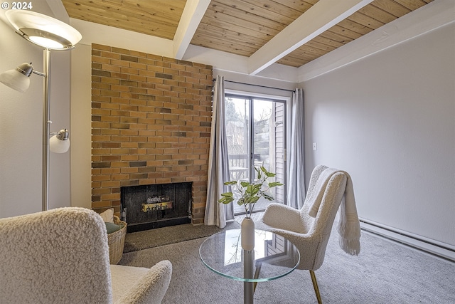 sitting room with a fireplace, beamed ceiling, and wood ceiling