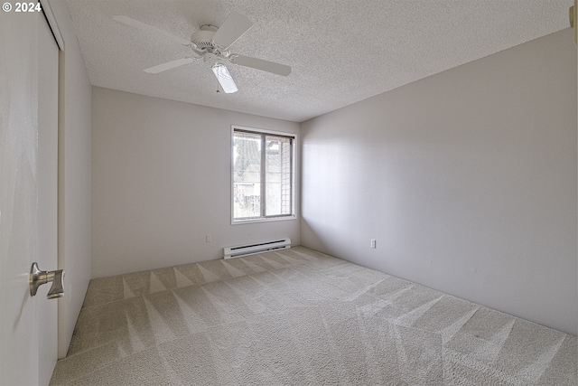 carpeted empty room with a textured ceiling, ceiling fan, and a baseboard heating unit