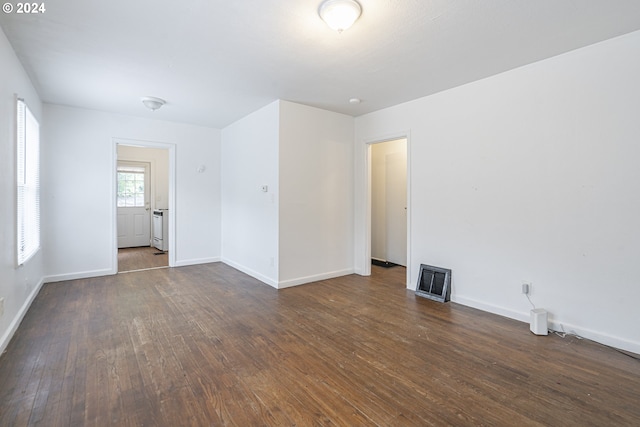 spare room with dark wood-type flooring