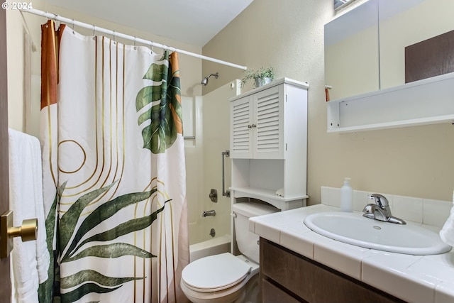 full bathroom featuring shower / tub combo, vanity, and toilet