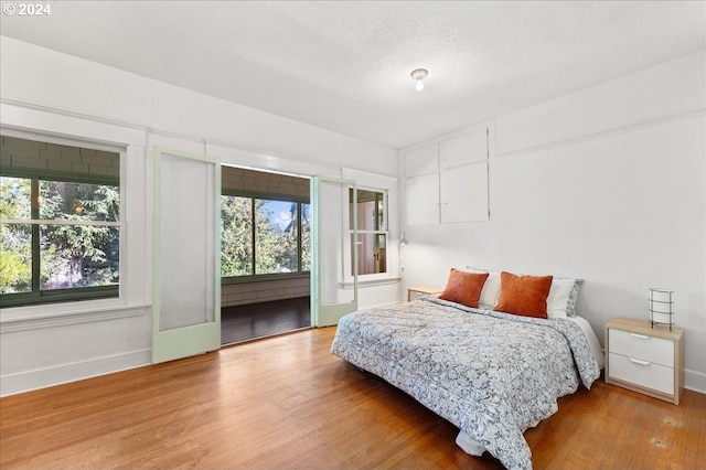 bedroom with wood-type flooring