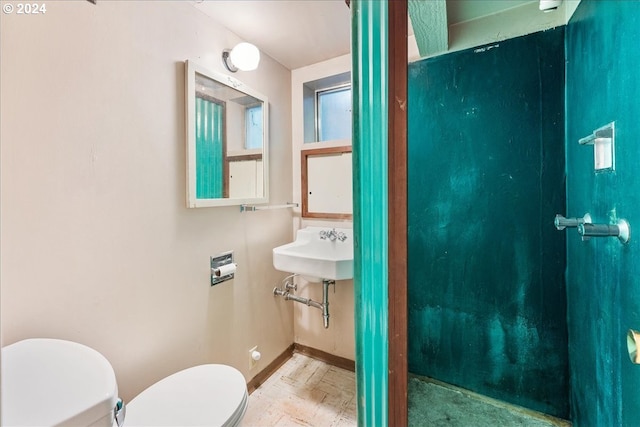 2626 SW Ravensview Dr, Portland, OR 97201 - half bath featuring toilet, baseboards, and a sink