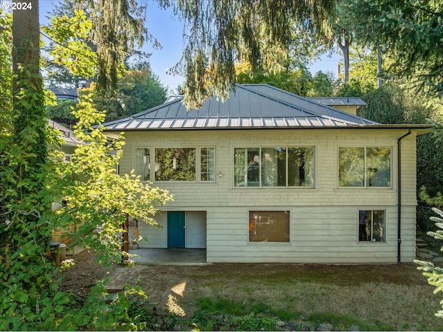 rear view of house featuring a patio area