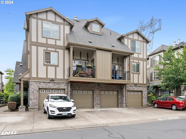 tudor house featuring a garage