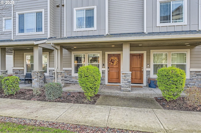 view of exterior entry with a porch