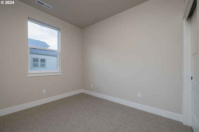 view of carpeted spare room