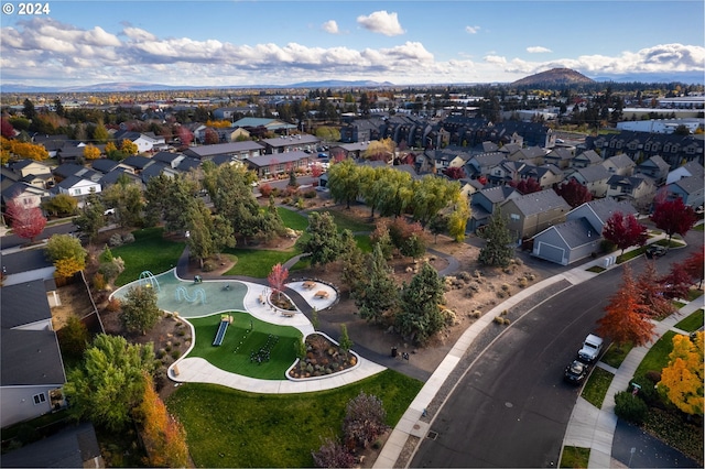 birds eye view of property featuring a mountain view