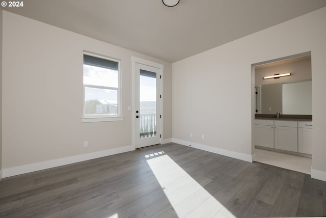 empty room with dark hardwood / wood-style flooring