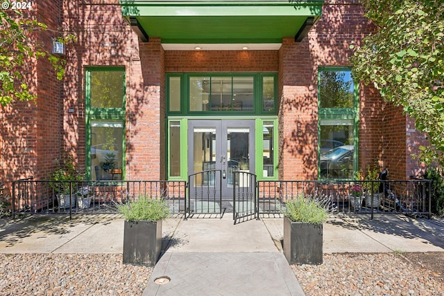 view of exterior entry featuring french doors