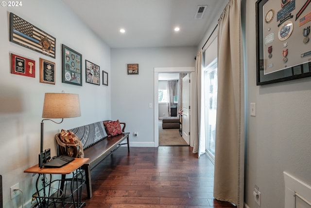 corridor with dark hardwood / wood-style floors