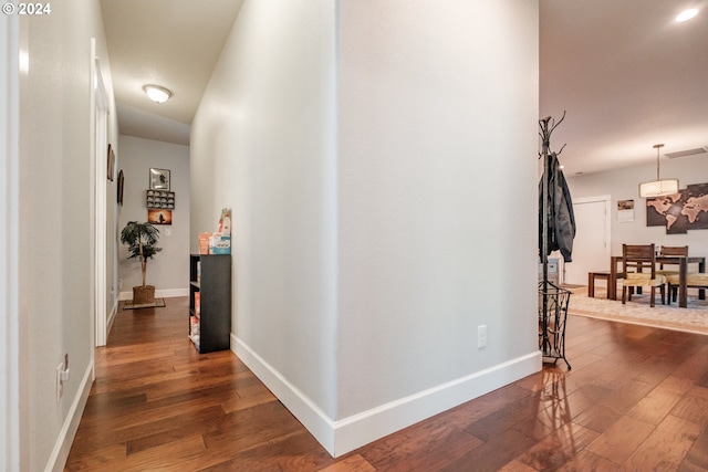 corridor featuring dark hardwood / wood-style floors