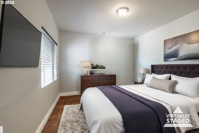 bedroom featuring dark wood-type flooring