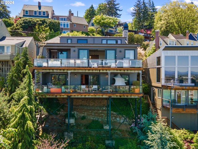 rear view of property with a balcony