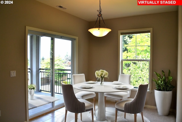 tiled dining space with plenty of natural light